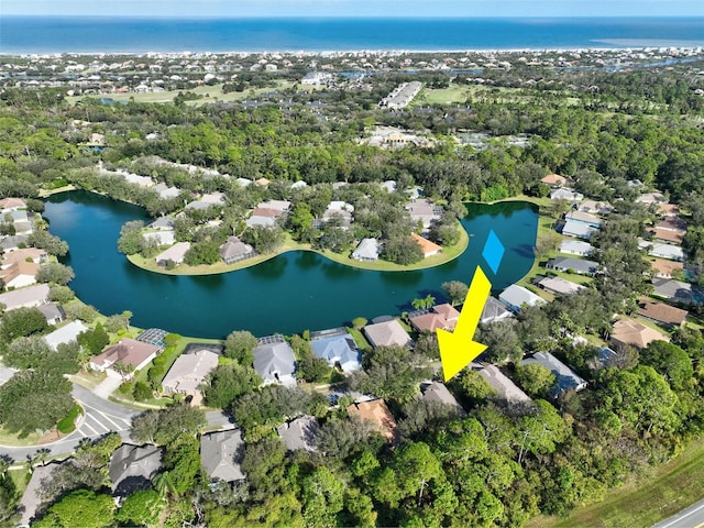 32 Shinnecock Dr, Palm Coast, FL 32137 - aerial view of property's location with nearby suburban area, a large body of water, and a tree filled landscape