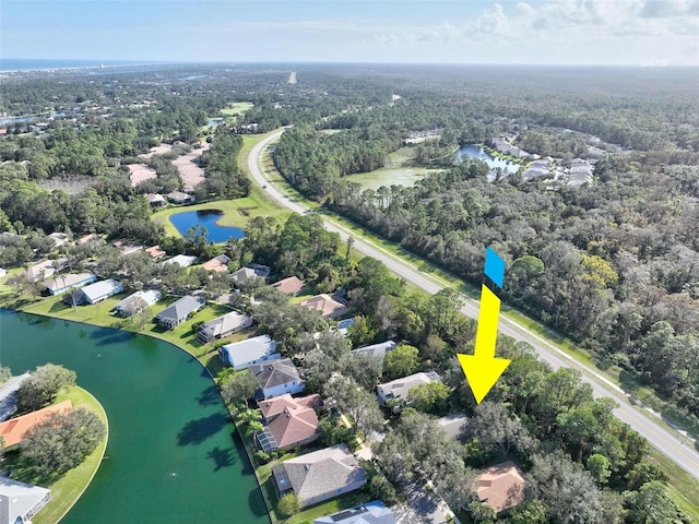 32 Shinnecock Dr, Palm Coast, FL 32137 - aerial view of residential area with a nearby body of water and a forest