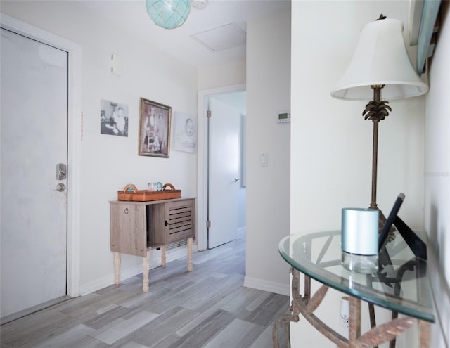 corridor with light hardwood / wood-style flooring