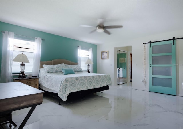 bedroom featuring a barn door, ceiling fan, and multiple windows