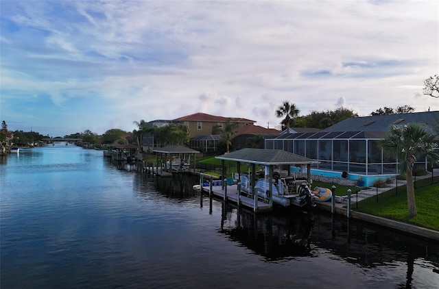 dock area with a water view and glass enclosure