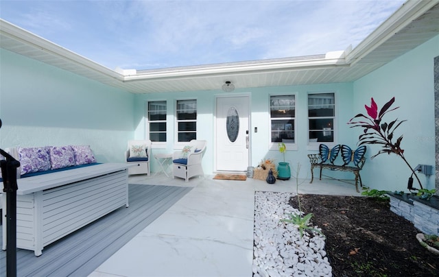 doorway to property with an outdoor living space