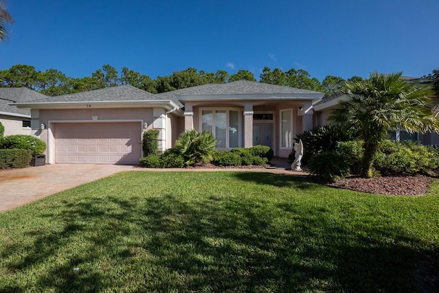 ranch-style home with a garage and a front lawn