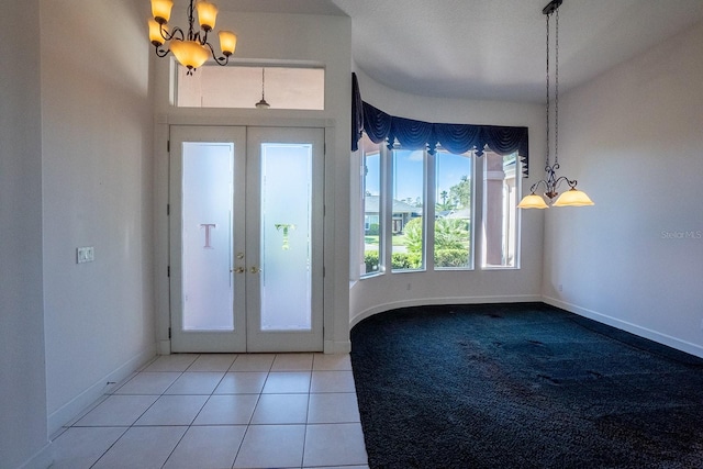 foyer with french doors and tile patterned floors