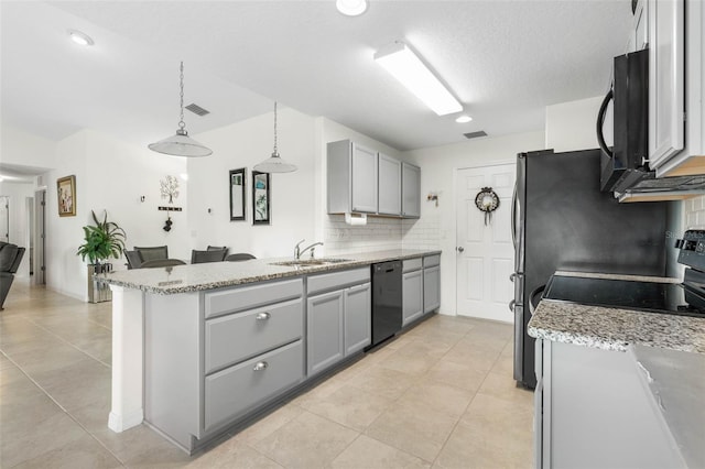 38 Colechester Ln, Palm Coast, FL 32137 - kitchen featuring black appliances, a sink, gray cabinets, a peninsula, and a textured ceiling