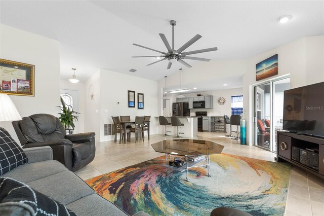 38 Colechester Ln, Palm Coast, FL 32137 - living room featuring light tile patterned floors, ceiling fan, vaulted ceiling, and recessed lighting