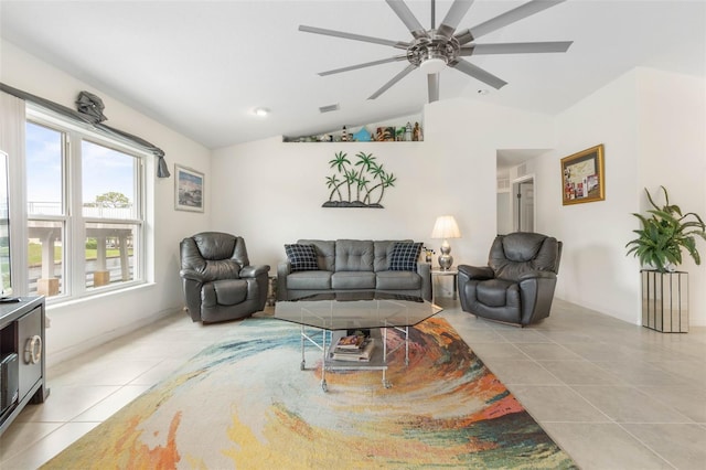 tiled living room with lofted ceiling and ceiling fan