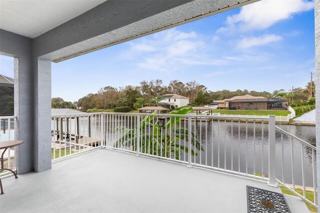 balcony featuring a water view