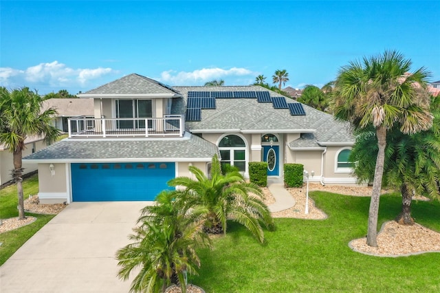 view of front of property featuring a garage and a front yard