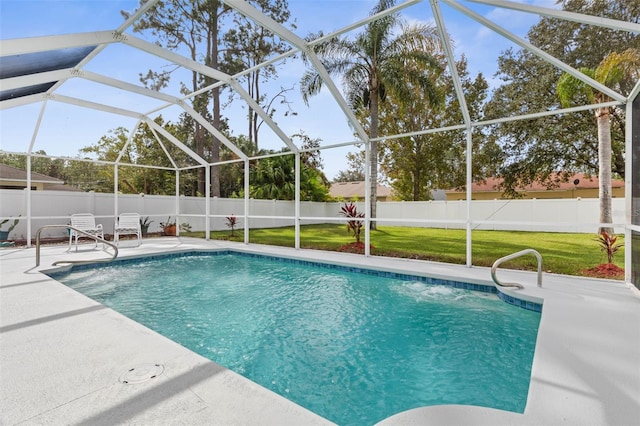 view of swimming pool with a lawn, glass enclosure, and a patio