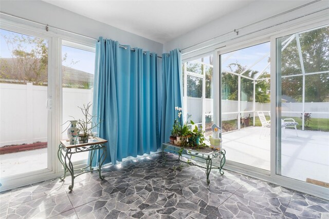 sunroom / solarium featuring plenty of natural light