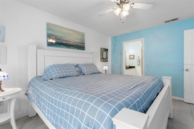 tiled bedroom with ceiling fan