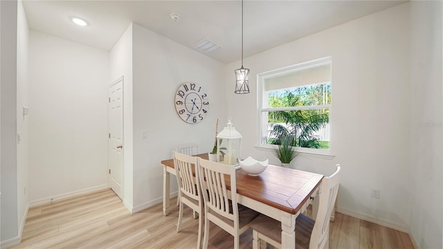 dining room with light hardwood / wood-style floors