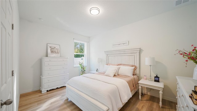 bedroom with light wood-type flooring