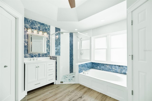 bathroom featuring independent shower and bath, vanity, and hardwood / wood-style flooring