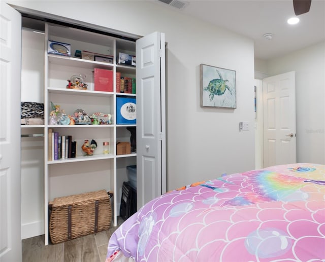 bedroom featuring a closet and light hardwood / wood-style floors