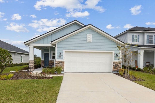 craftsman inspired home with a garage, a porch, and a front lawn