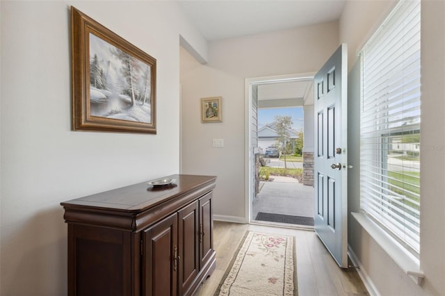 doorway to outside with light hardwood / wood-style floors