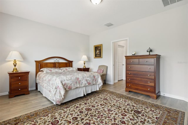 bedroom with light hardwood / wood-style flooring