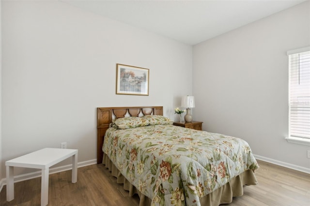 bedroom with wood-type flooring