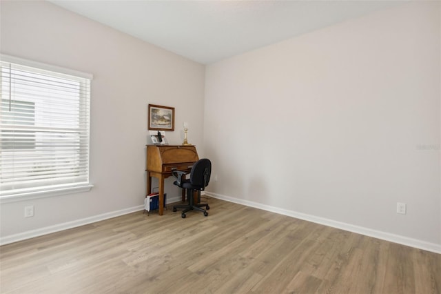 home office with light wood-type flooring