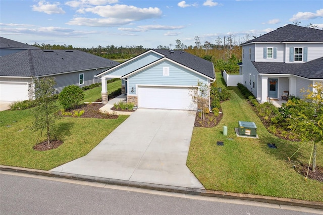 view of front facade with a front yard and a garage