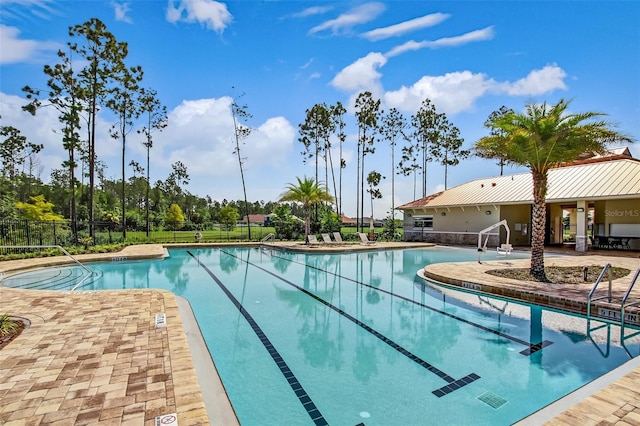 view of swimming pool featuring a patio