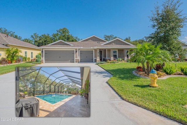 view of front of house with a garage, a front lawn, and a lanai