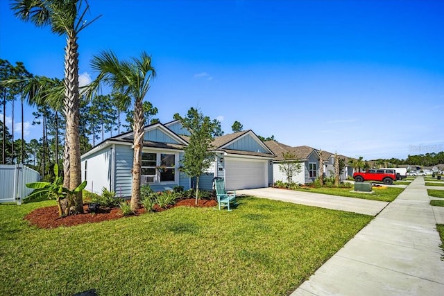 ranch-style house featuring a front lawn and a garage