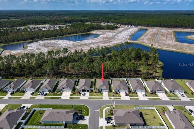 drone / aerial view with a water view