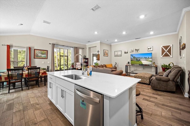 kitchen featuring dishwasher, a center island with sink, sink, white cabinets, and light hardwood / wood-style floors