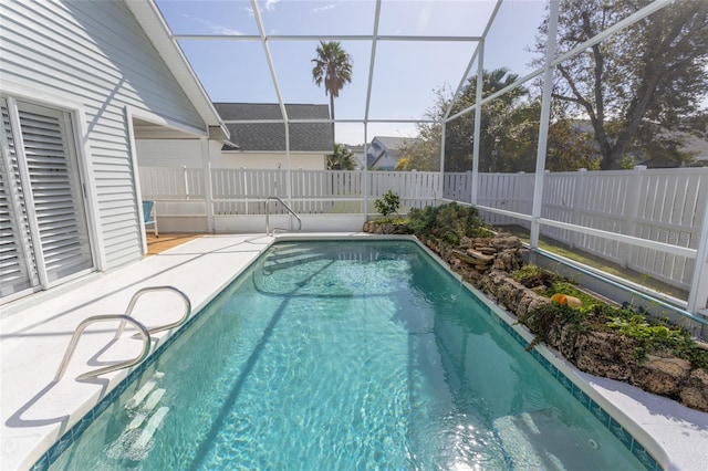 view of pool with a lanai and a patio area