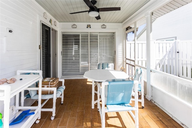 sunroom / solarium featuring wooden ceiling and ceiling fan