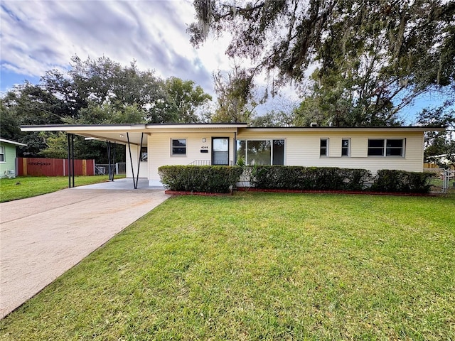 view of front facade featuring a front yard and a carport