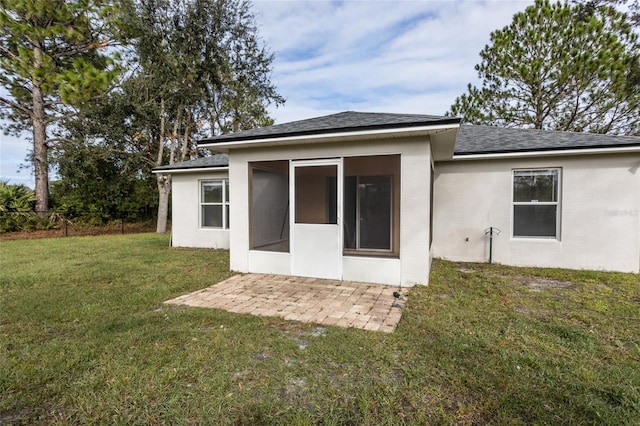 30 Sergeant Ct, Palm Coast, FL 32164 - rear view of house featuring roof with shingles, a sunroom, and a patio area