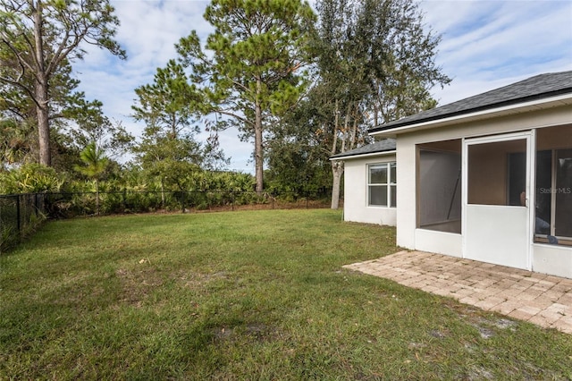 view of yard featuring a sunroom