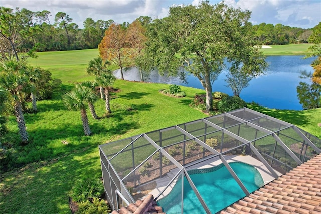 view of pool featuring a lanai, a yard, and a water view