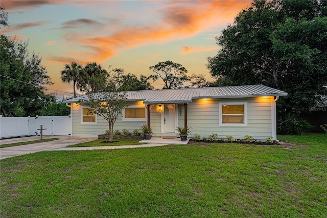 ranch-style house featuring a yard