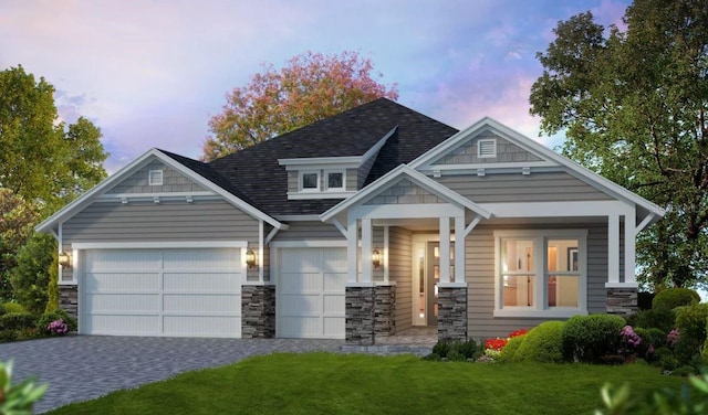 craftsman inspired home featuring a lawn and a garage