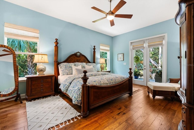 bedroom featuring hardwood / wood-style floors, ceiling fan, and access to exterior