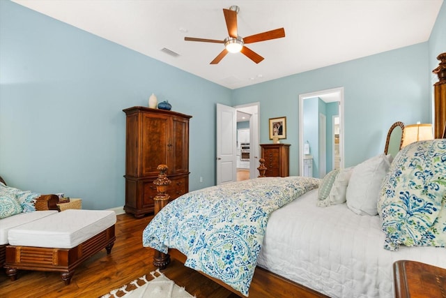 bedroom featuring ensuite bath, ceiling fan, and dark hardwood / wood-style flooring