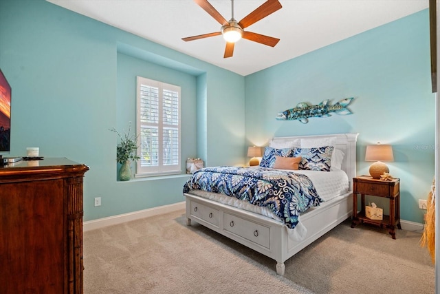 bedroom featuring ceiling fan and light colored carpet