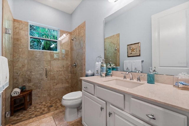 bathroom with walk in shower, vanity, and toilet