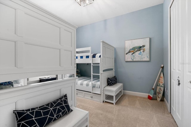 carpeted bedroom featuring a closet