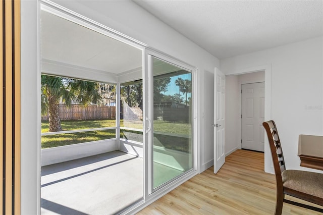 entryway featuring light hardwood / wood-style floors and a textured ceiling