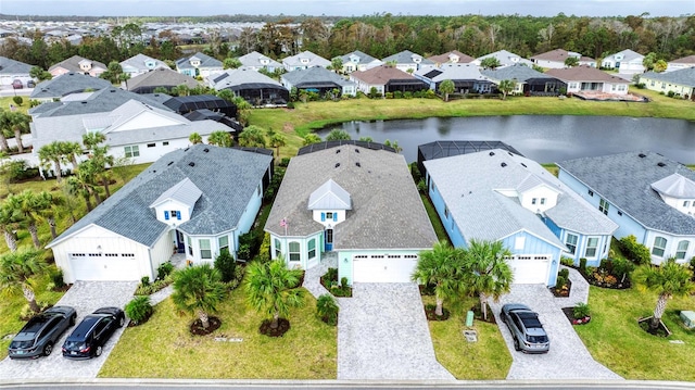 birds eye view of property with a water view