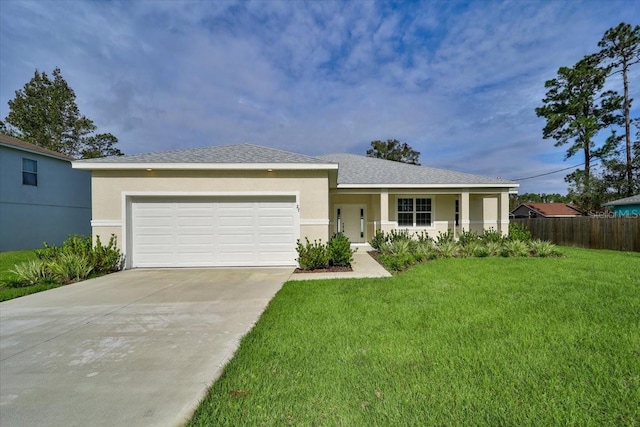 view of front facade with a garage and a front yard