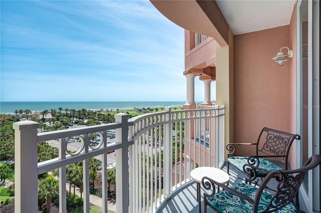 balcony featuring a water view