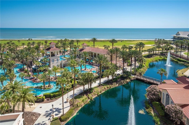 birds eye view of property with a water view