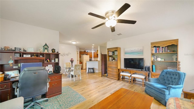 office space with ceiling fan and light hardwood / wood-style flooring